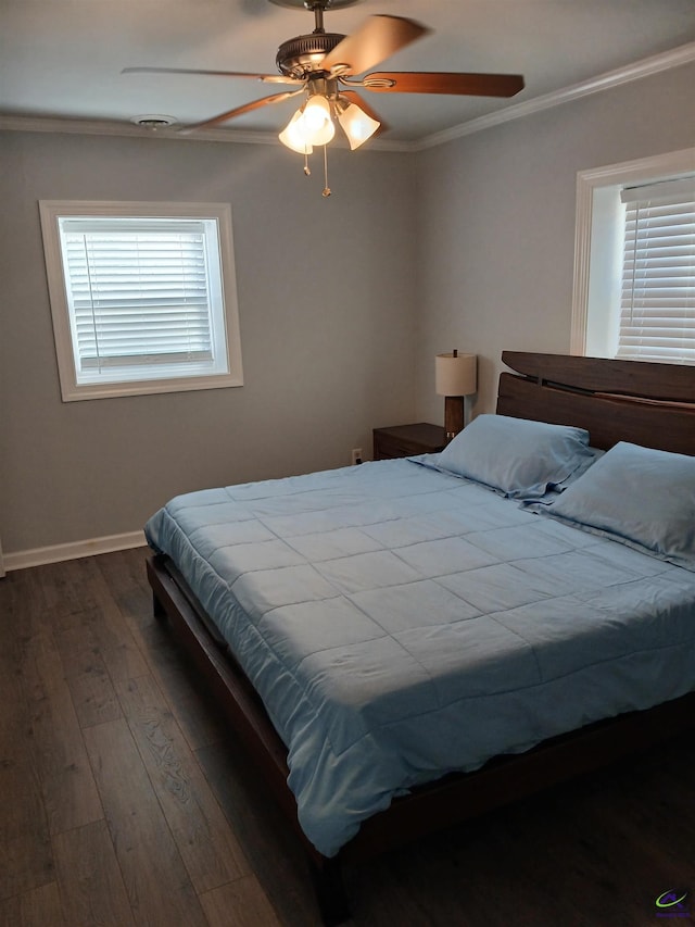 bedroom featuring dark wood-type flooring, ceiling fan, and crown molding