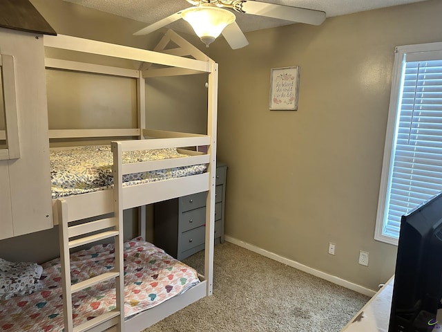 bedroom with ceiling fan and carpet floors