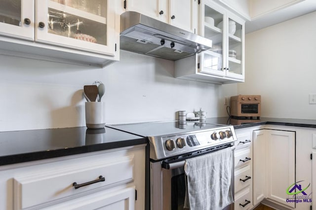 kitchen featuring white cabinetry, stainless steel electric stove, and range hood