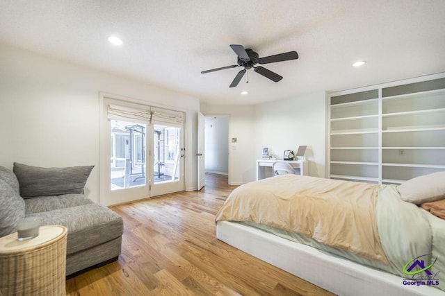 bedroom featuring ceiling fan, access to exterior, and hardwood / wood-style floors