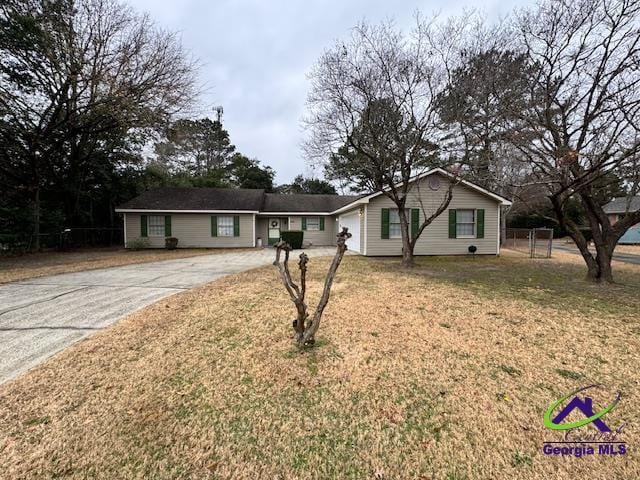 ranch-style home with a front lawn