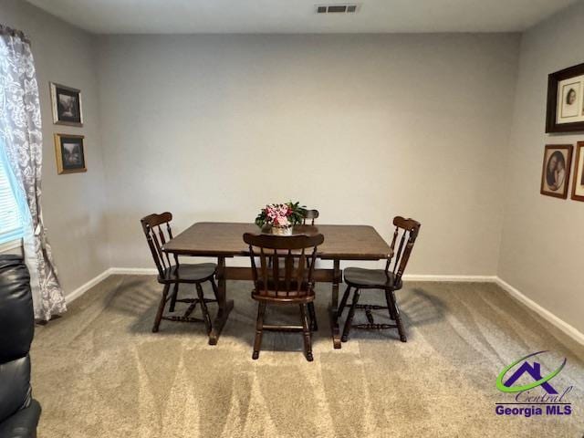 view of carpeted dining area