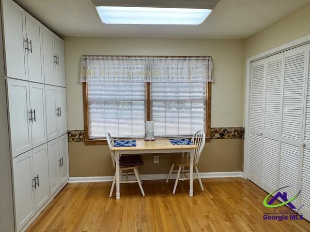 unfurnished dining area with a wealth of natural light and light hardwood / wood-style flooring