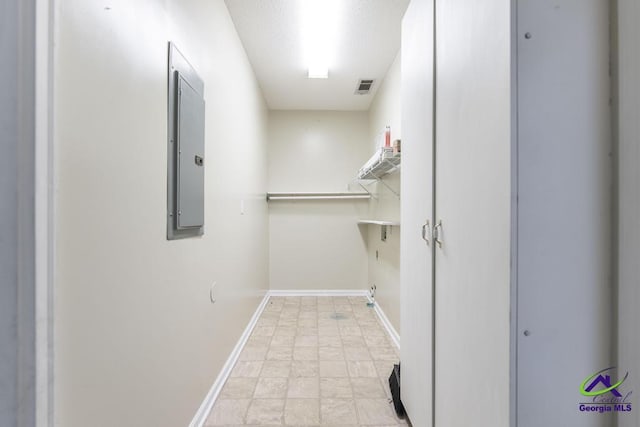 laundry room with electric panel