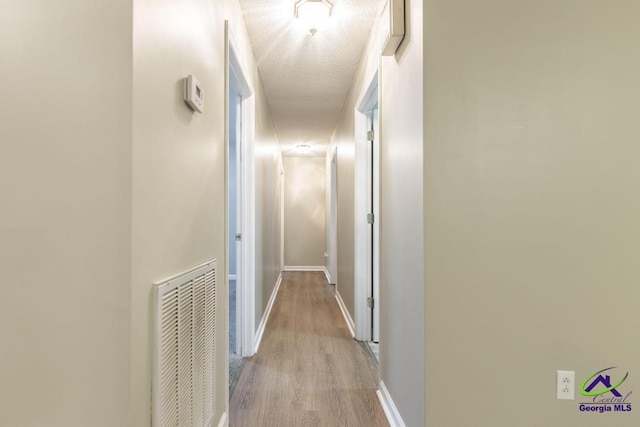 hallway featuring light hardwood / wood-style flooring