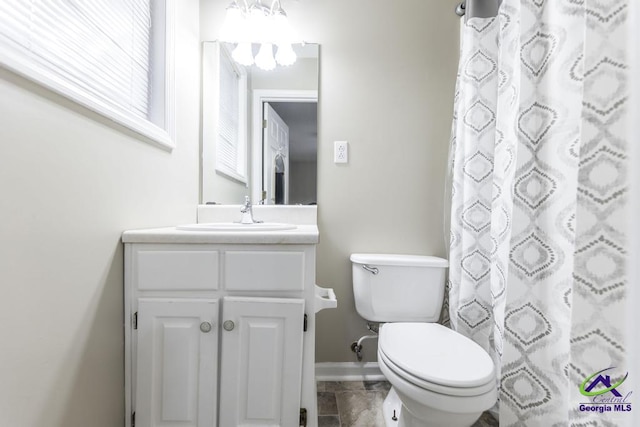 bathroom featuring vanity, a shower with curtain, and toilet