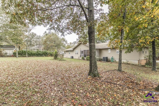 view of yard with central AC