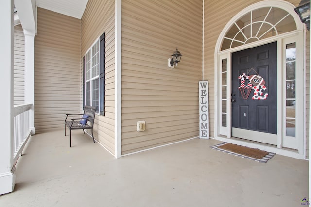 doorway to property with covered porch