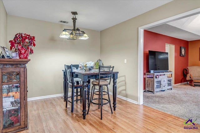 dining area featuring hardwood / wood-style floors