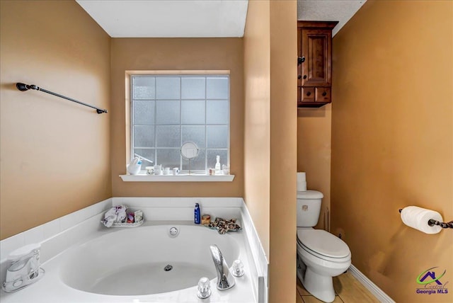 bathroom featuring toilet and a bathing tub