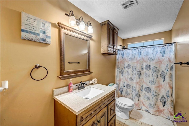 bathroom with curtained shower, tile patterned flooring, vanity, toilet, and a textured ceiling