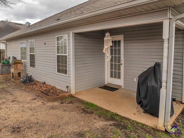 entrance to property featuring a patio area