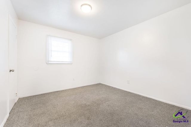 empty room featuring carpet flooring