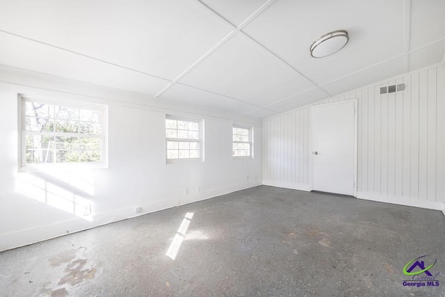 spare room with vaulted ceiling