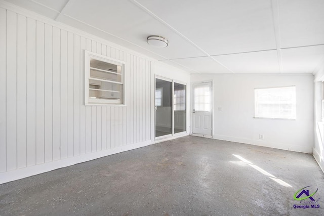 empty room with concrete flooring