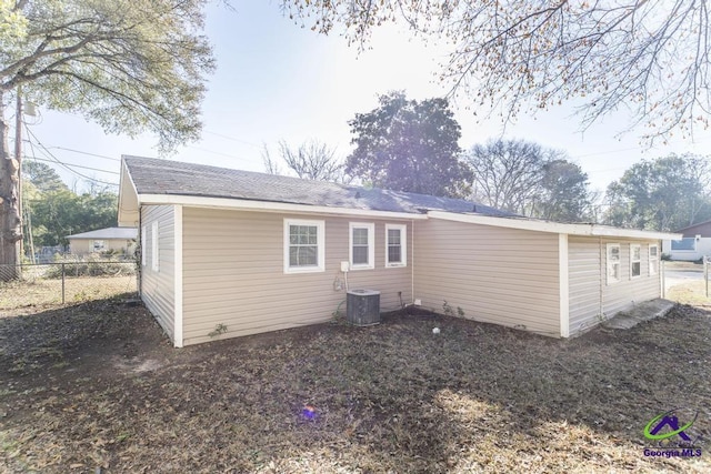 rear view of property with central air condition unit