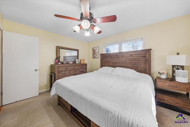 bedroom with light carpet and ceiling fan