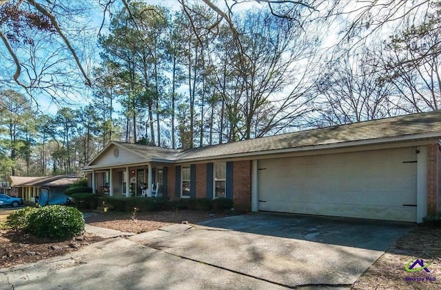 ranch-style home with a garage and a porch