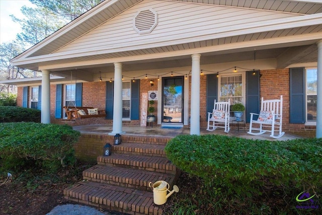 doorway to property featuring a porch