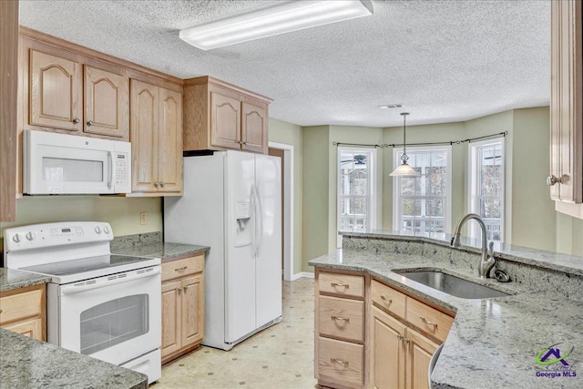 kitchen with sink, light stone counters, decorative light fixtures, light brown cabinets, and white appliances