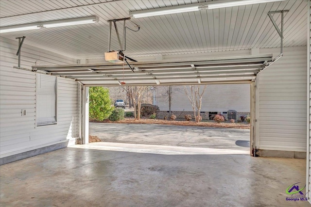 garage featuring a carport and a garage door opener