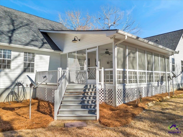 exterior space featuring a sunroom and ceiling fan