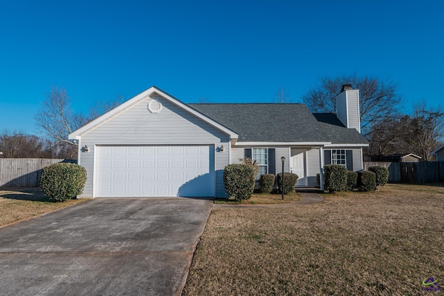 ranch-style house with a garage and a front lawn