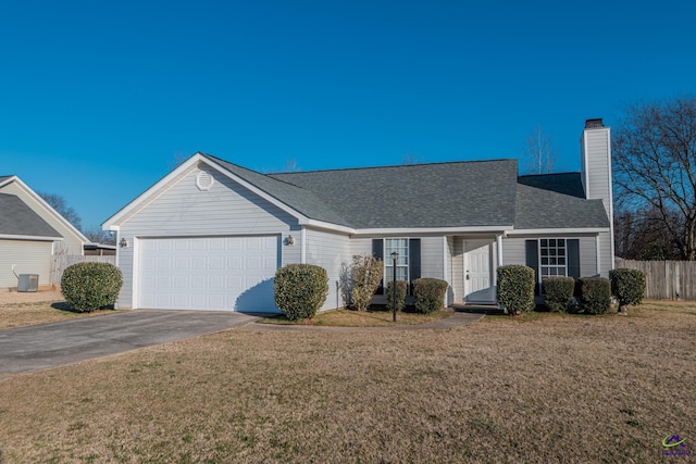 ranch-style home featuring central AC, a garage, and a front yard