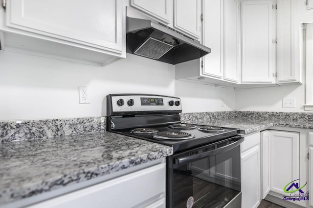 kitchen with white cabinetry, black electric range oven, and light stone counters