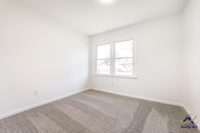 unfurnished room with carpet floors