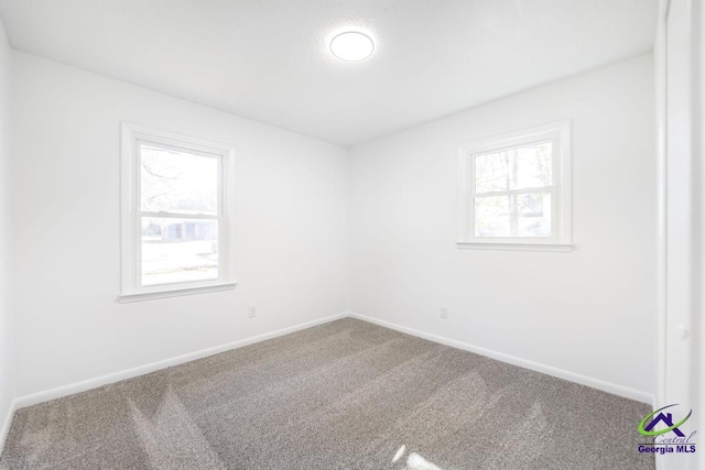 unfurnished room with carpet flooring