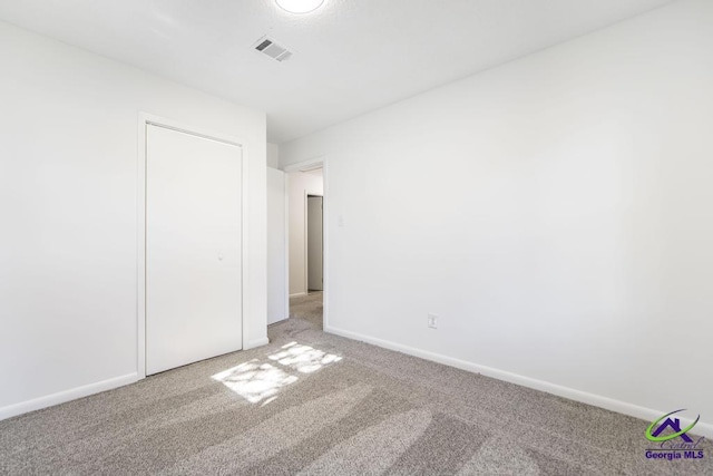 unfurnished bedroom with carpet