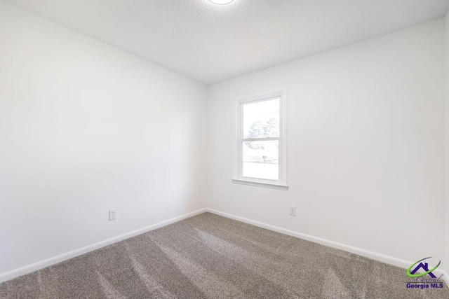 empty room with carpet flooring