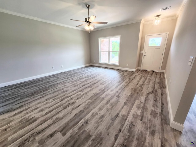 unfurnished living room with ornamental molding, wood finished floors, visible vents, and baseboards