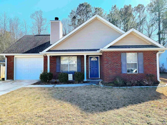 view of front facade with a garage and a front yard