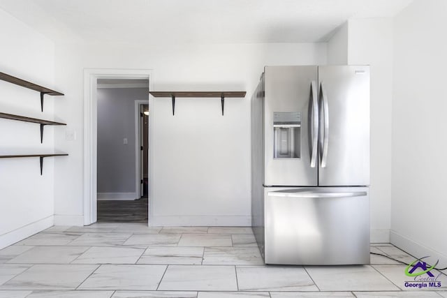 kitchen with stainless steel fridge with ice dispenser