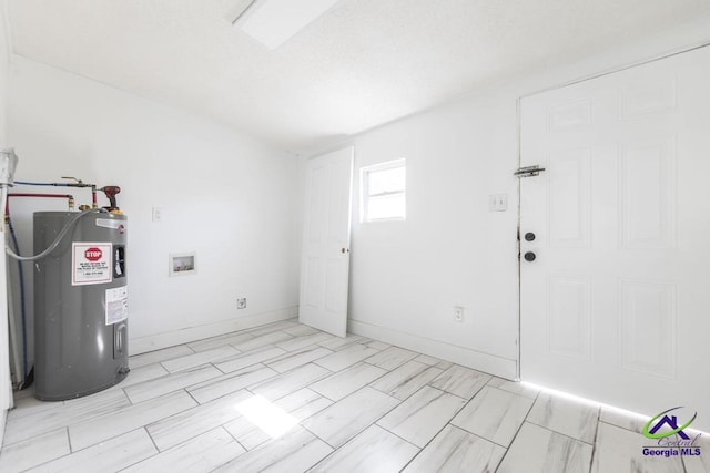 interior space with hookup for a washing machine and electric water heater