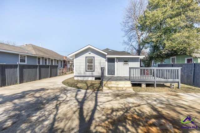 back of property with a wooden deck