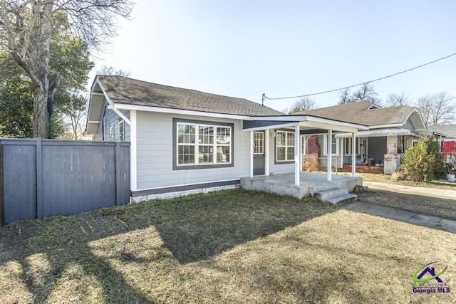 view of front of home with a porch and a front lawn