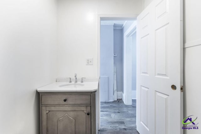 bathroom featuring vanity and hardwood / wood-style floors