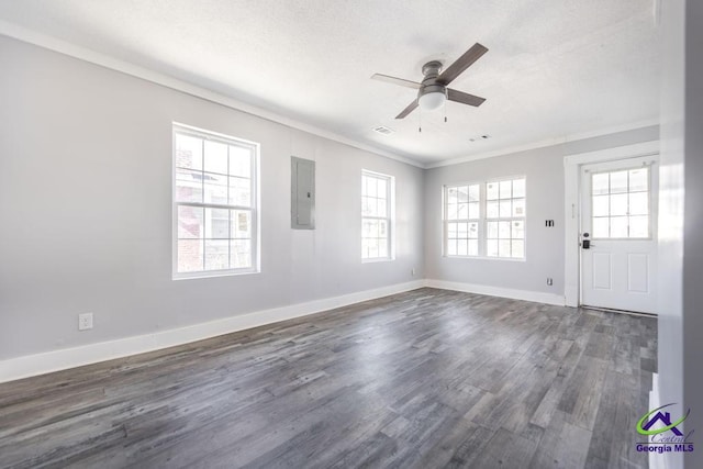 unfurnished room with crown molding, ceiling fan, dark hardwood / wood-style flooring, and electric panel