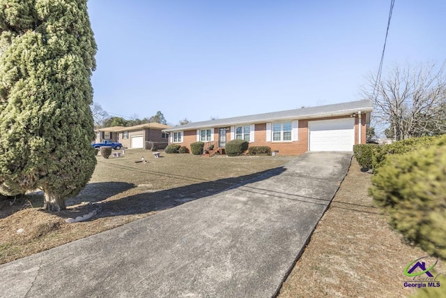 ranch-style house featuring a garage