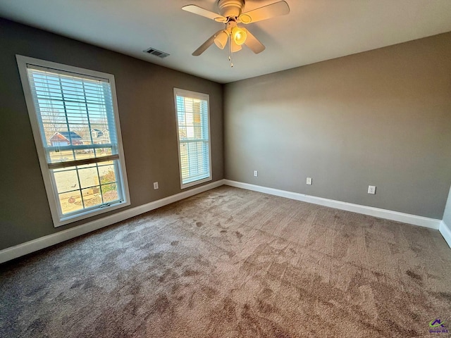 carpeted empty room with ceiling fan