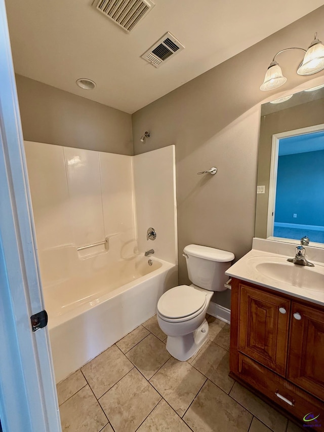 full bathroom with vanity, tub / shower combination, tile patterned floors, and toilet