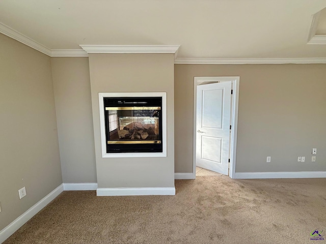 spare room with light carpet, crown molding, and a multi sided fireplace