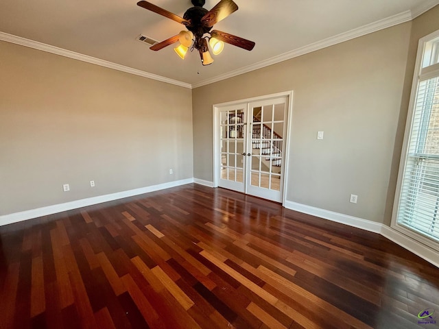 empty room featuring crown molding, dark wood-type flooring, french doors, and ceiling fan