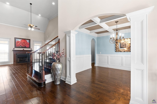 staircase with hardwood / wood-style flooring, ceiling fan, coffered ceiling, and a wealth of natural light