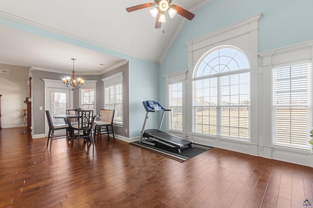 exercise area featuring crown molding, dark wood-type flooring, ceiling fan with notable chandelier, and high vaulted ceiling