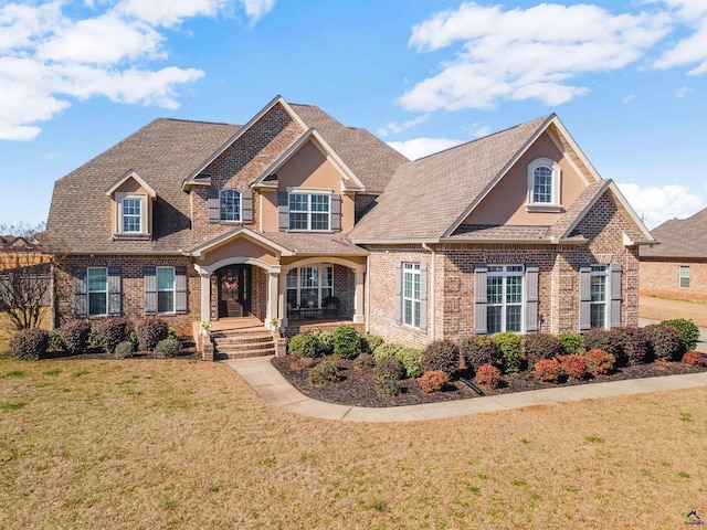 craftsman inspired home with a front yard