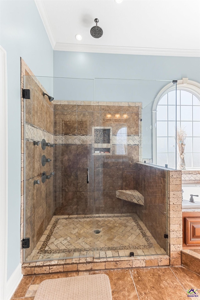 bathroom with ornamental molding and a shower with shower door